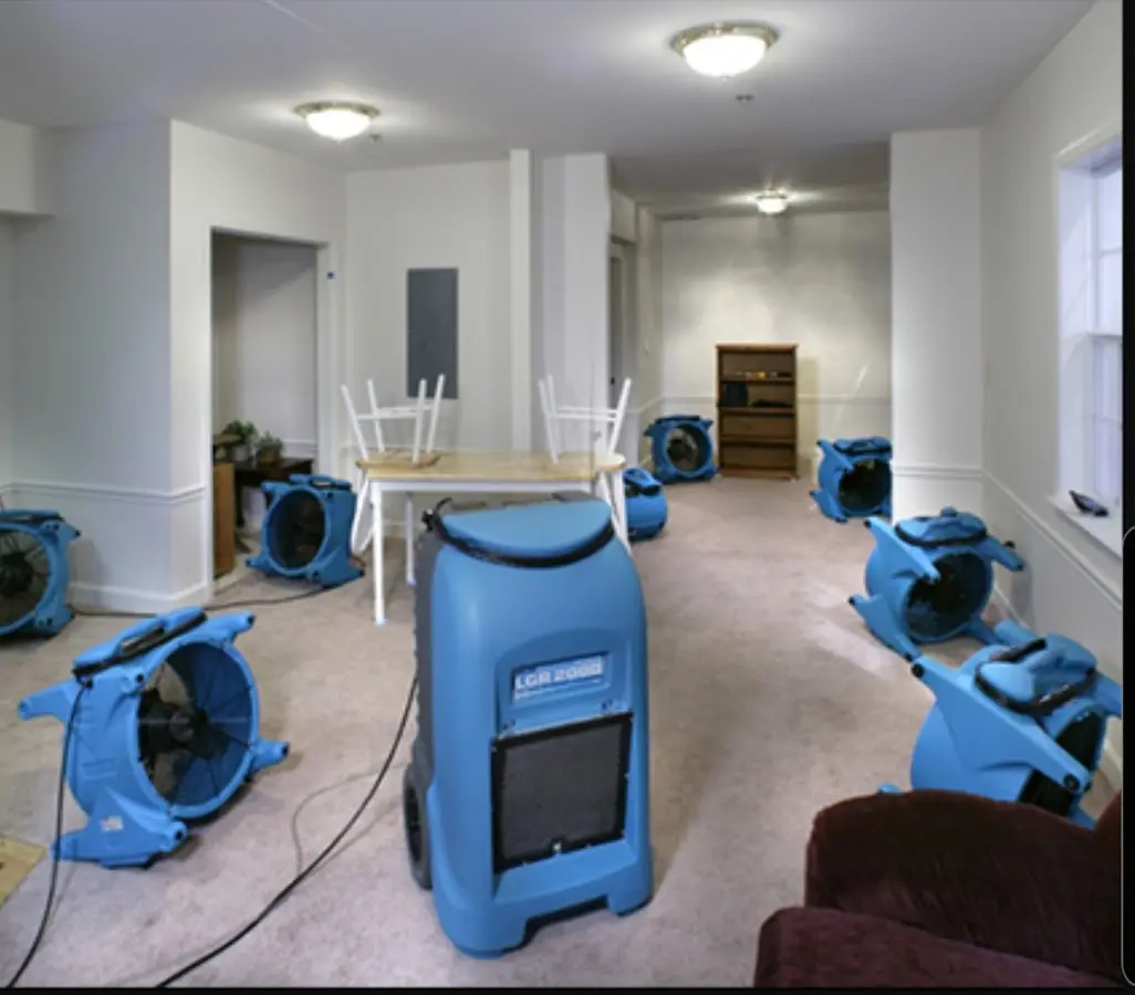 Air movers and dehumidifier setup for Water Damage Restoration in Millstone